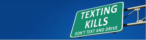 Road sign that reads 'texting kills'