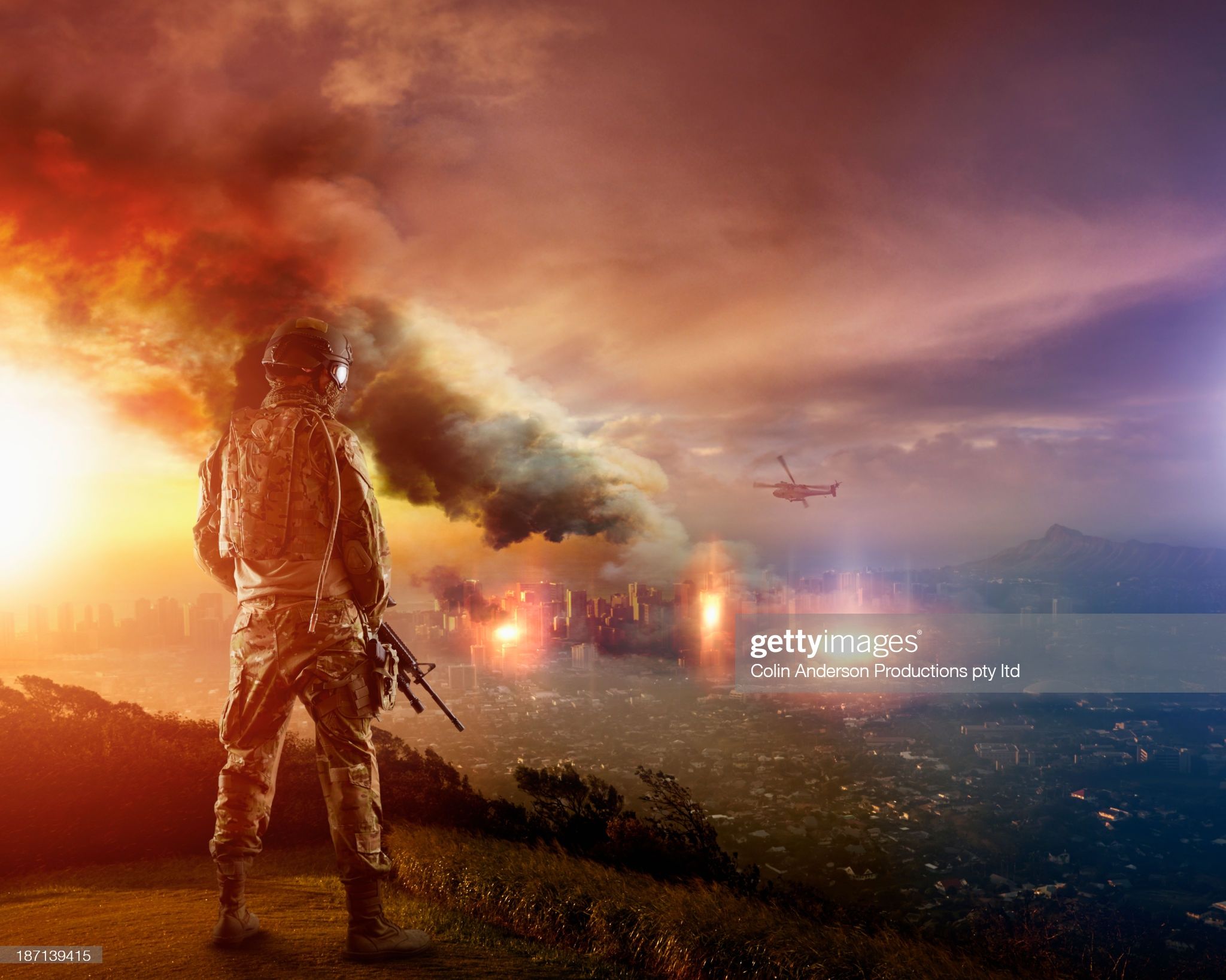 Soldier overlooking destroyed city